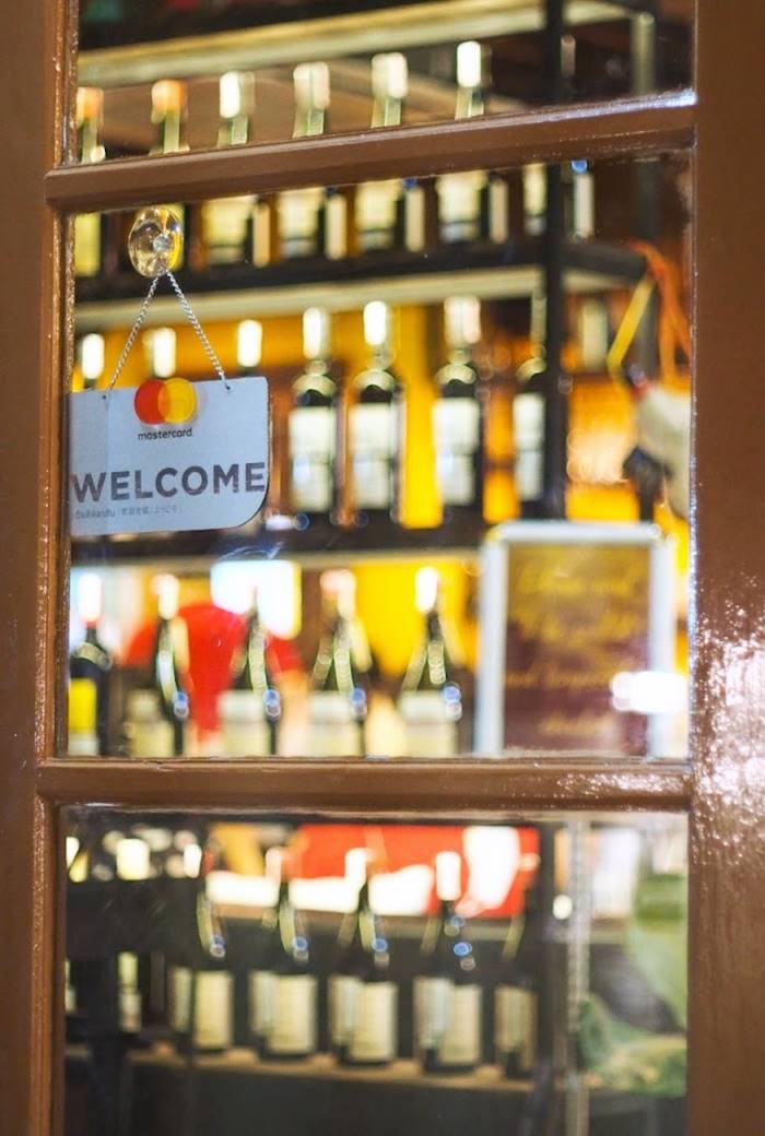 Doorway with Welcoming Message at El Tapeo Spanish Eatery & Wine Bar